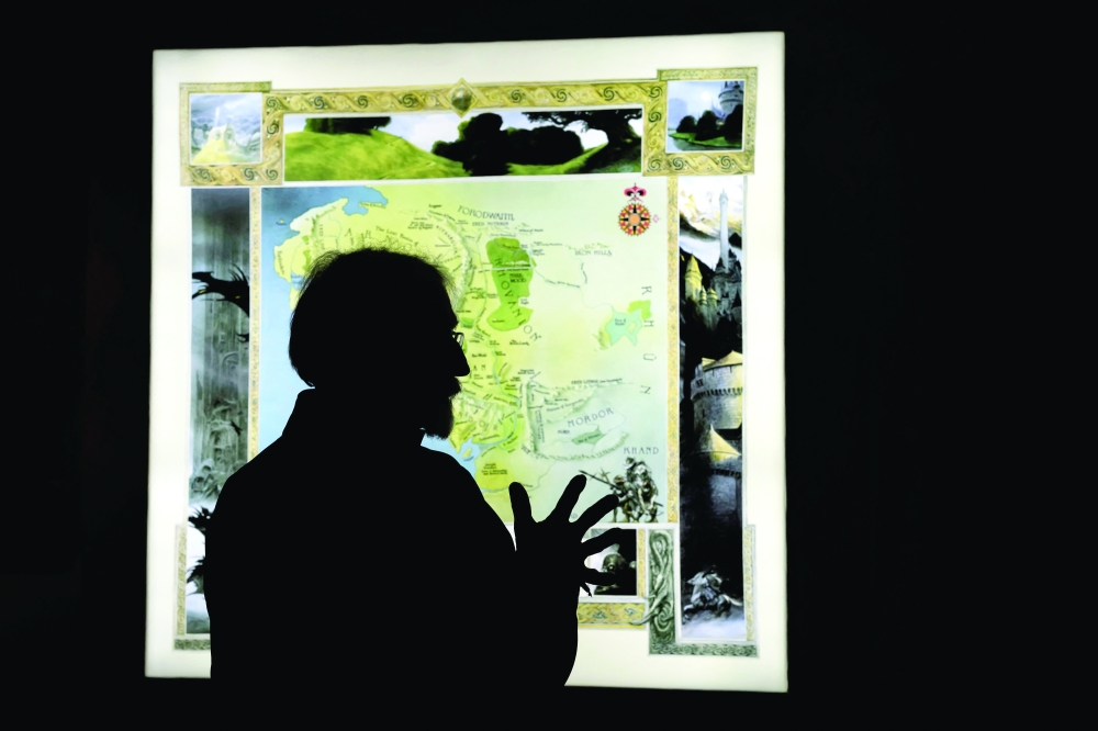 Illustrator John Howe drawing at La Tour du Fantastique (The Tower of the Fantastic) new museum in Neuchatel. — AFP