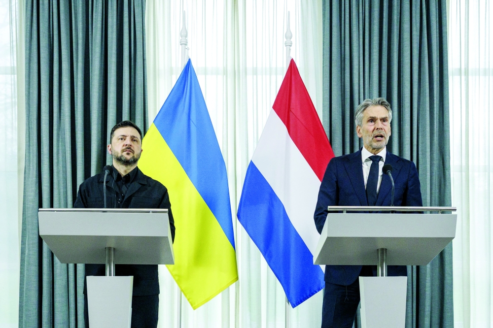 Ukrainian President Volodymyr Zelensky (L) and Dutch PM Dick Schoof address a joint press conference at the Catshuis in The Hague. — AFP