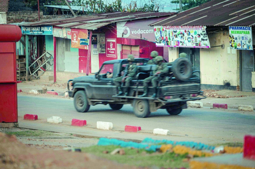 A patrol car of the M23 group patrols in Uvira. — AFP