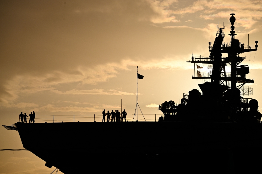 The Wasp-class amphibious assault ship USS Iwo Jima (LHD7) is docked at Rafael Cordero Santiago Port of the Americas on December 16, 2025, in Ponce, Puerto Rico.  