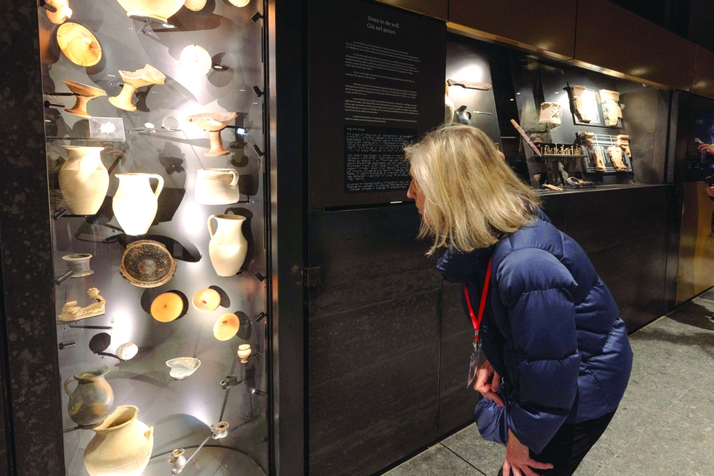People look at the artifacts found during the construction of the new metro line at the Colosseum metro station. — Reuters 