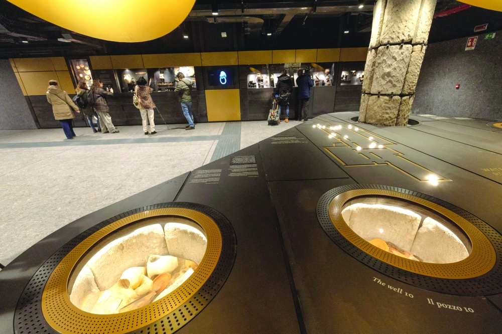 People look at the artifacts found during the construction of the new metro line at the Colosseum metro station. — Reuters 