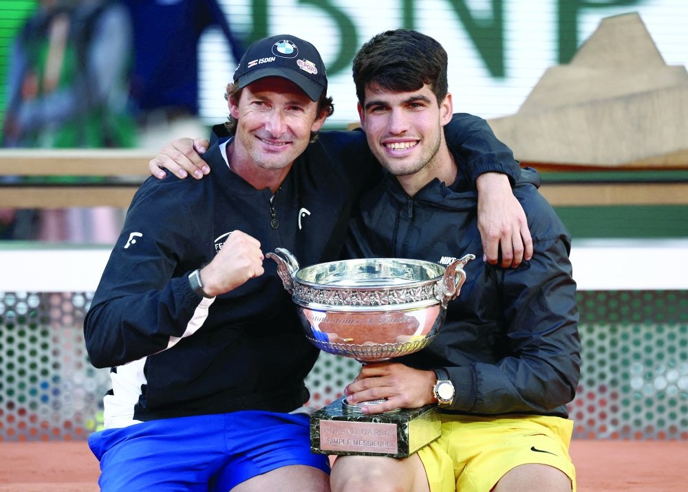 FILE PHOTO: Spain's Carlos Alcaraz celebrates with coach Juan Carlos Ferrero after winning the men's singles final against Germany's Alexander Zverev. — Reuters