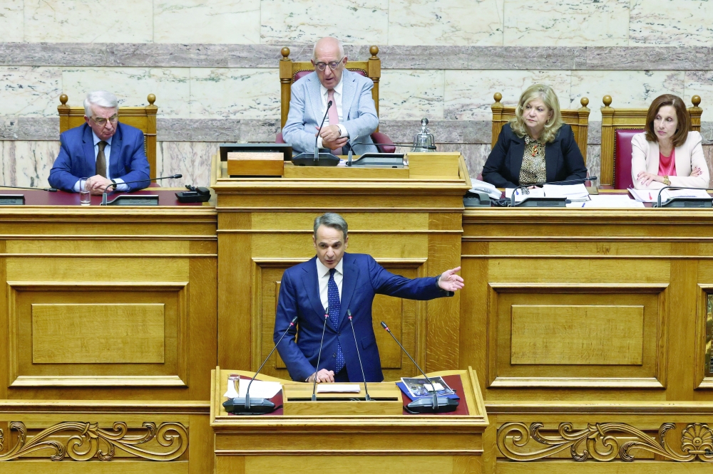Greek PM Kyriakos Mitsotakis speaks at the Greek parliament, in Athens. — Reuters