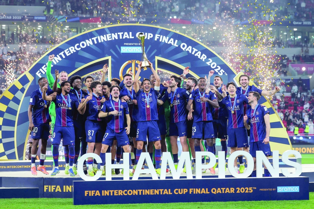 PSG's players celebrate with the trophy after winning the 2025 Fifa Intercontinental Cup final. — AFP