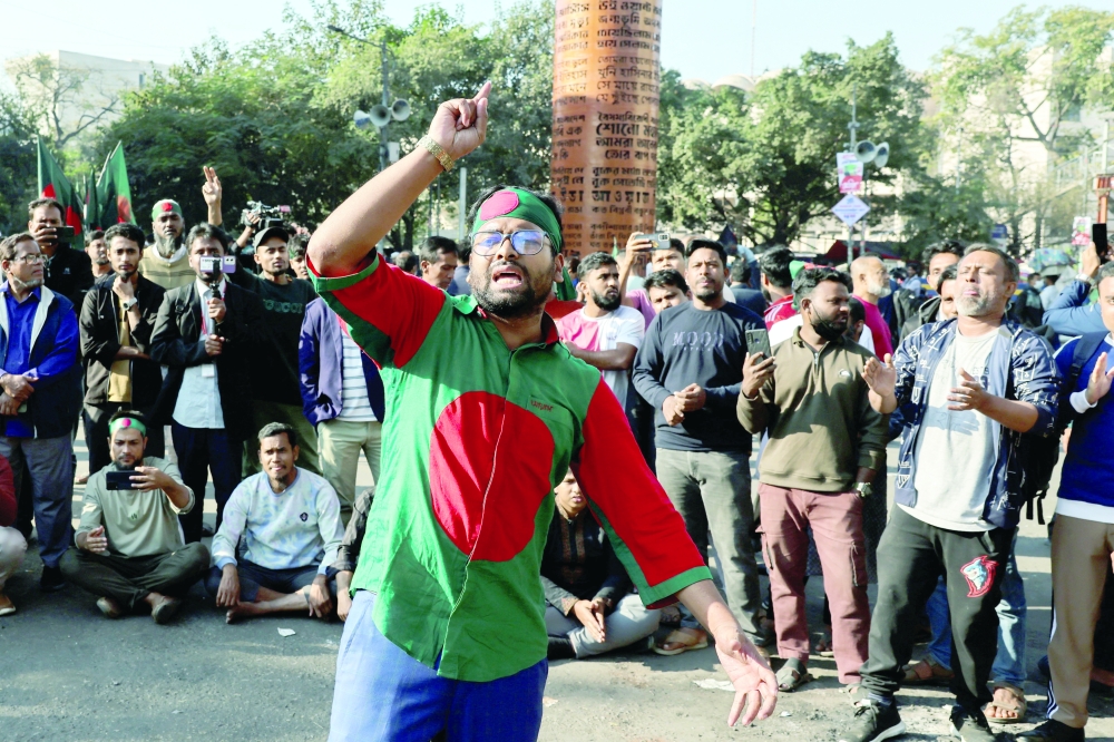 Supporters chant slogans as they block Shahbagh in Dhaka. — Reuters