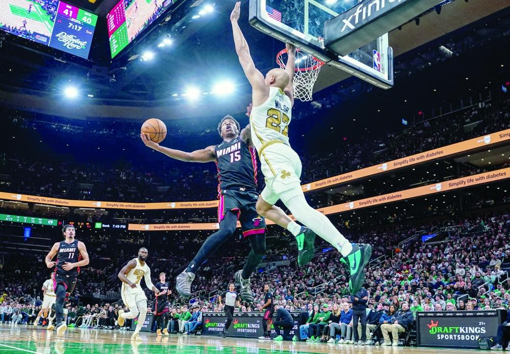 Boston Celtics guard Jordan Walsh (27) defends against Miami Heat forward Myron Gardner (15)  — Imagn Images 