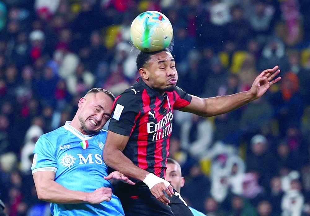 AC Milan's Christopher Nkunku in action with Napoli's Stanislav Lobotka. — Reuters