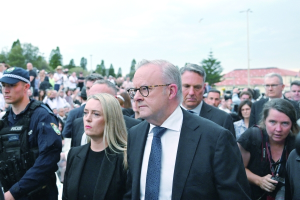 Australia falls silent, lights candles for Bondi Beach victims