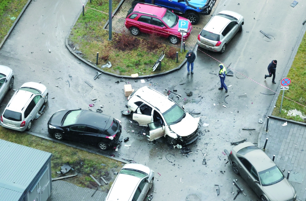 The damaged car lies at the scene after bombed in Moscow. — Reuters