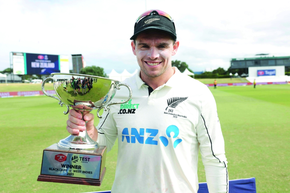 New Zealand's Tom Latham celebrates the series victory after day five of the 3rd international Test cricket match between New Zealand and West Indies. — AFP