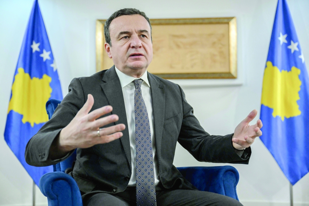 Kosovo's acting PM Albin Kurti, gestures as he speaks during an interview, in Pristina. — AFP