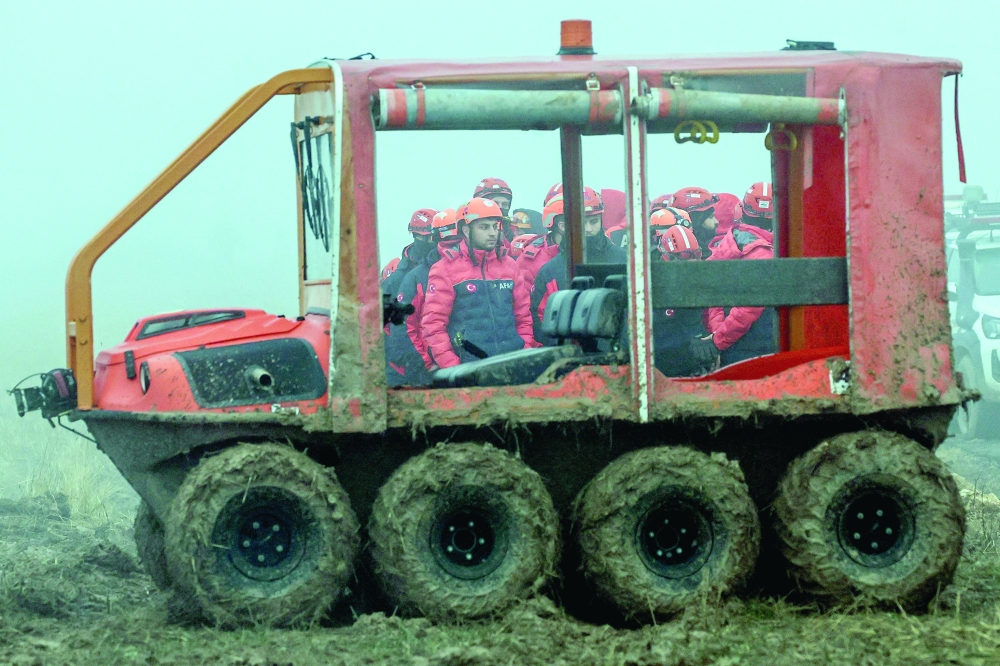 Rescuers work as search and rescue operations continue in Ankara. — AFP