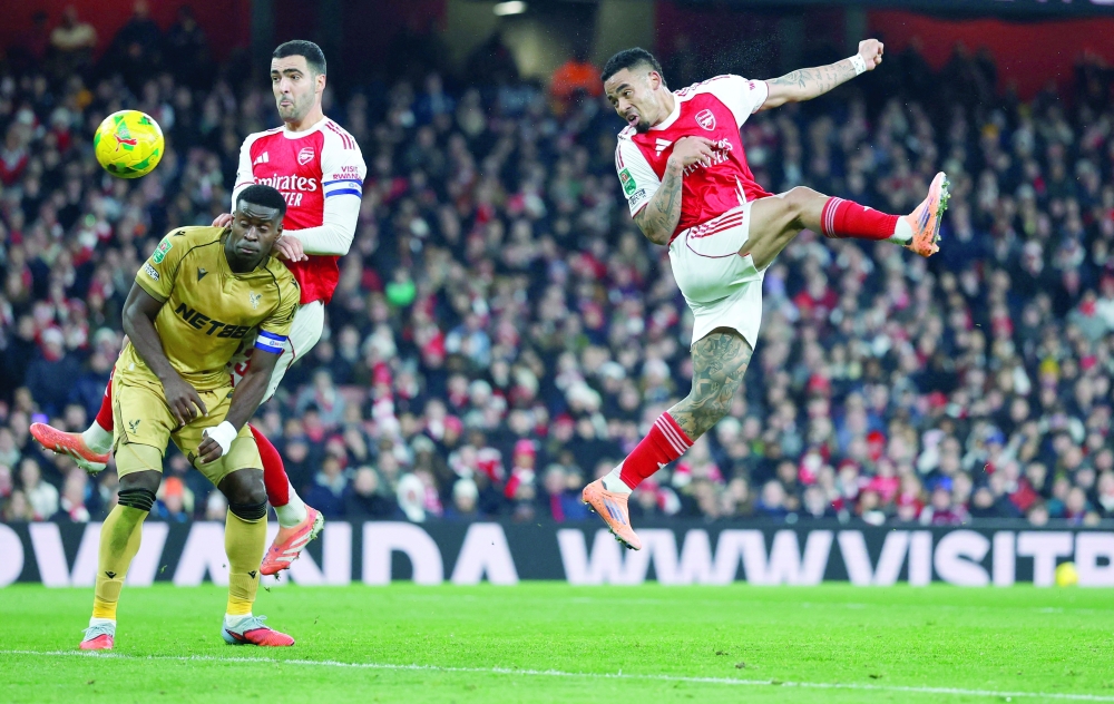 Arsenal's Gabriel Jesus heads at goal. — Reuters