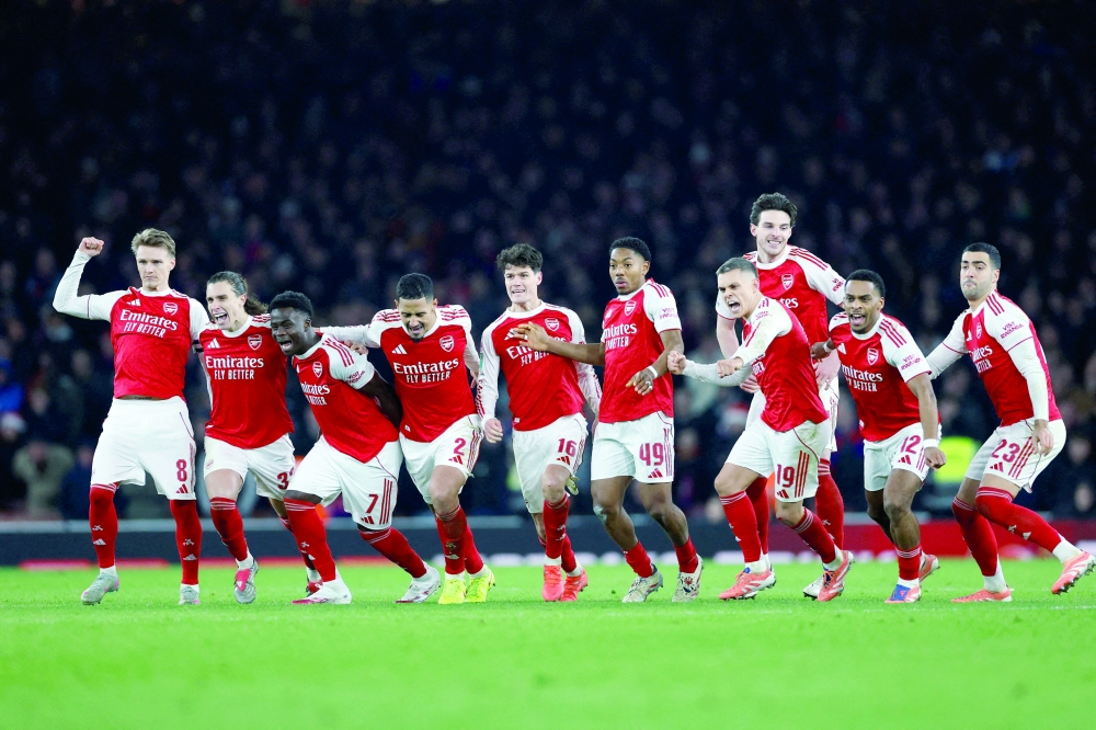 Arsenal celebrate after winning the penalty shootout. — Reuters