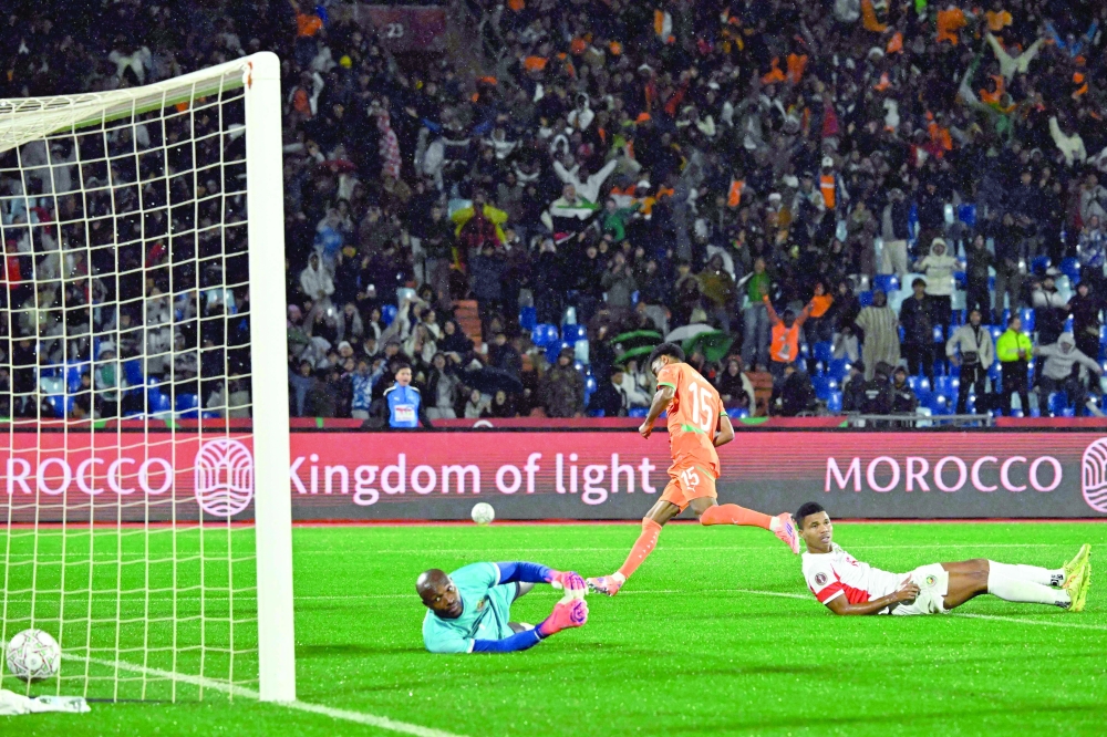 Ivory Coast's forward #15 Amad Diallo (C) celebrates scoring the team's first goal during the Africa Cup of Nations (CAN) Group F football match between Ivory Coast and Mozambique at Marrakesh Stadium in Marrakesh on December 24, 2025.   (Photo by Khaled DESOUKI / AFP)
