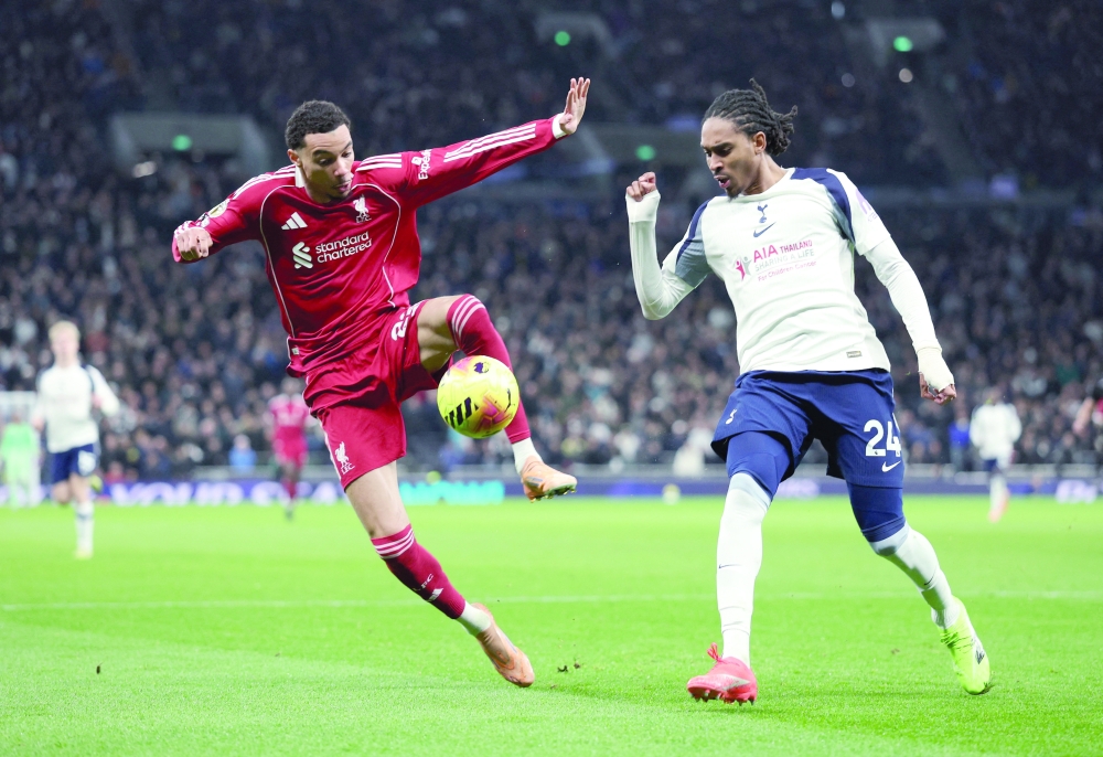 Tottenham Hotspur's Djed Spence in action with Liverpool's Hugo Ekitike. — Reuters