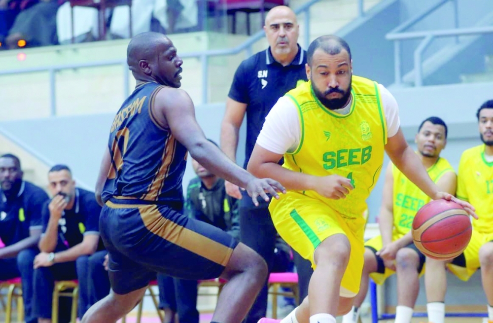 Seeb player challenges Al Bashayer defensive wall