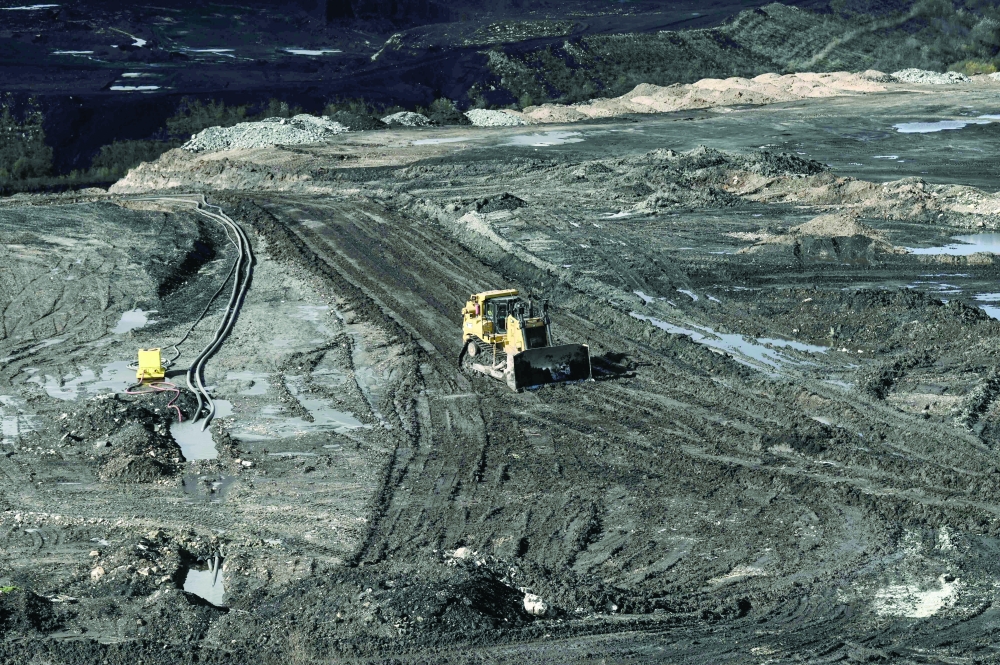 A vehicle during operating during an excavation at an interrupted lignite-fired power plant, near Ptolemaida, in northwestern Greece. — AFP