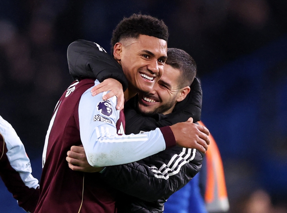 Aston Villa's Ollie Watkins and Emiliano Buendia celebrate after the match 