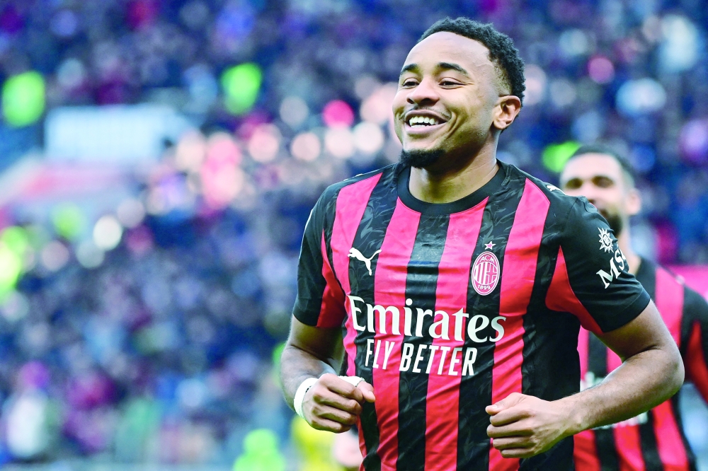 AC Milan's French forward #18 Christopher Nkunku celebrates after scoring his team second goal. — AFP