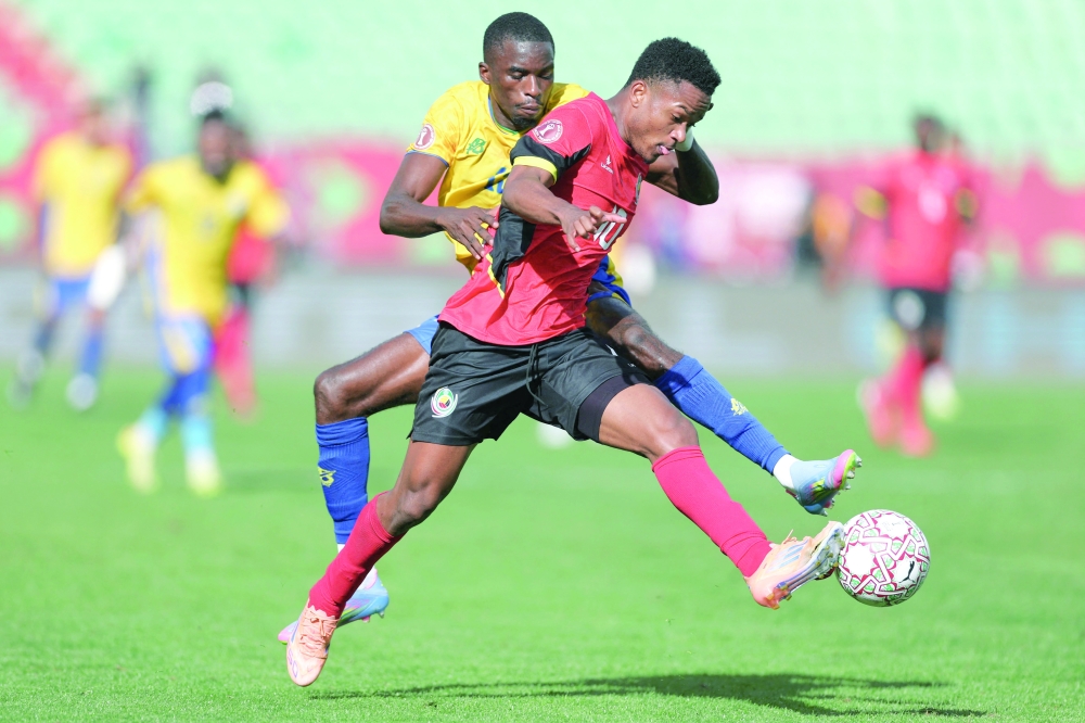 Gabon's defender #13 Mick Kila Omfia and Mozambique's midfielder #10 Geny Catamo vie during the Africa Cup of Nations. — AFP