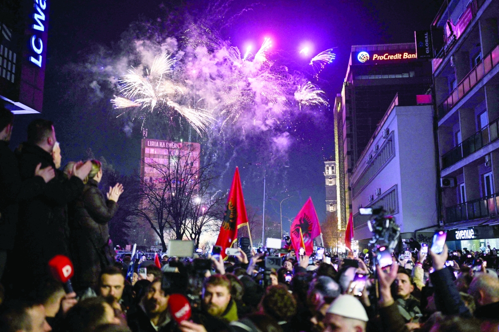 Supporters of the Vetevendosje Movement (LVV) celebrate the party痴 election result in Pristina. — AFP