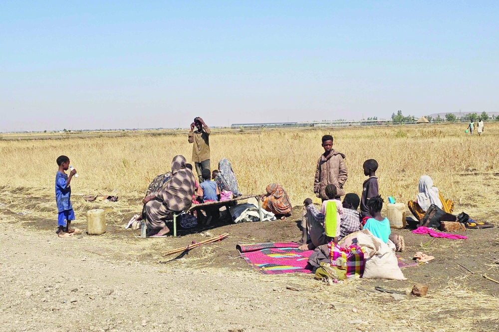 Displaced Sudanese react after spending a night in Gedaref city eastern Sudan on December 26, 2025 after the Rapid Support Forces (RSF) took control of the Heglig area in western Sudan. Since its outbreak in April 2023, the war between Sudan's army and the paramilitary Rapid Support Forces (RSF) has killed tens of thousands of people and displaced nearly 12 million. At the end of October, the paramilitary group seized control El-Fasher, the conclusion of a bitter 18-month siege for the strategic hub in western Sudan's Darfur region and marked by reports of mass killings and sexual violence. (Photo by AFP)
