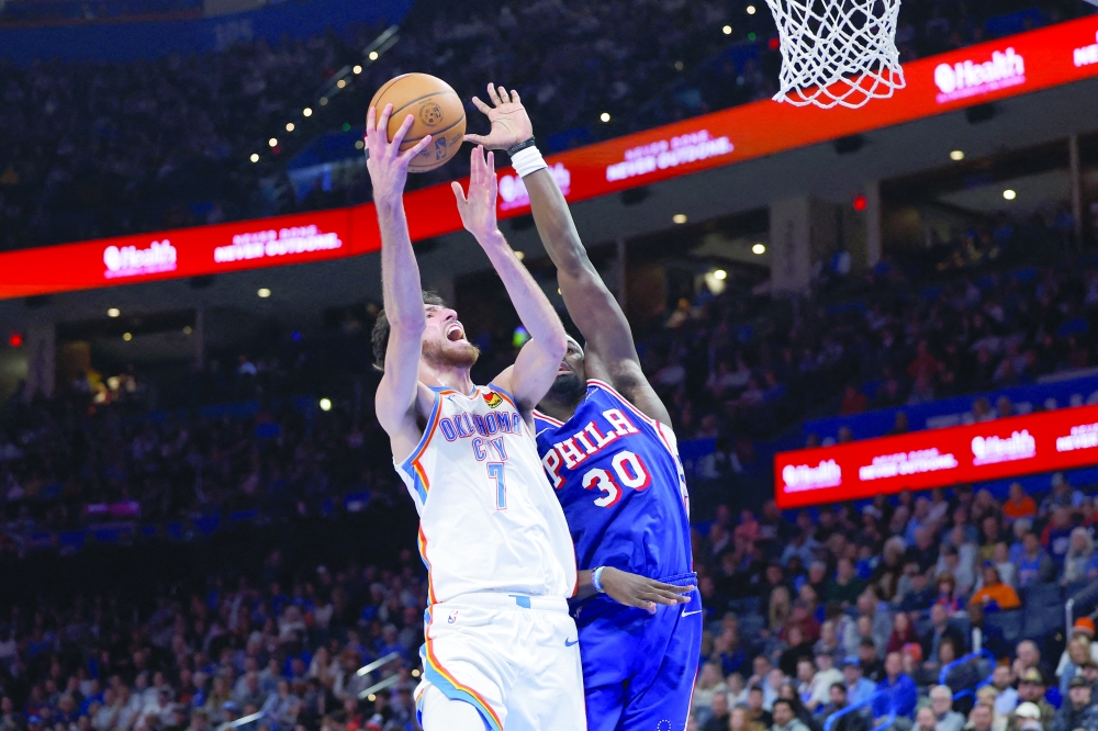 Oklahoma City Thunder's Chet Holmgren (7) goes up for a basket beside Philadelphia 76ers' Adem Bona (30) at Paycom Center. — Imagn Images