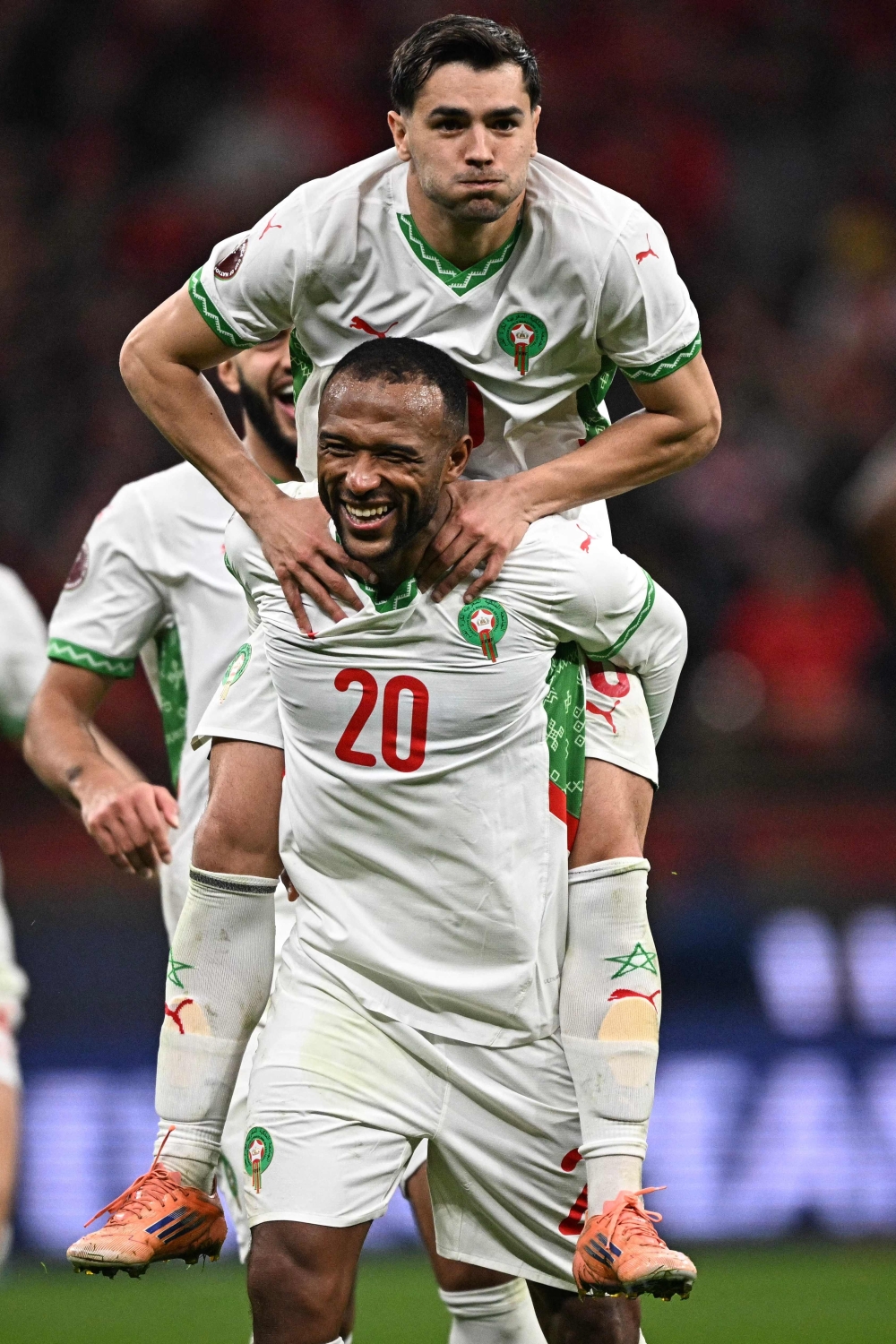 Morocco's Ayoub El Kaabi (L) celebrates scoring his team's third goal with Morocco's Diaz (R) 