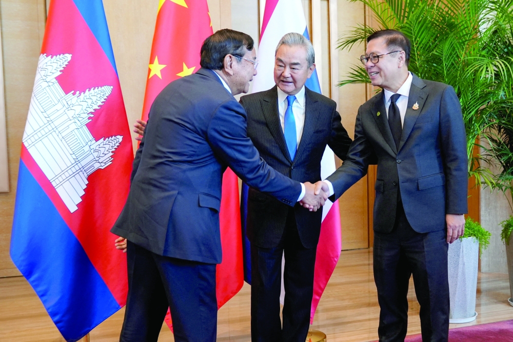 Chinese FM Wang Yi meets with Thailand's FM Sihasak Phuangketkeow and Cambodian Deputy PM Prak Sokhonn in Yuxi, Yunnan province. — Reuters