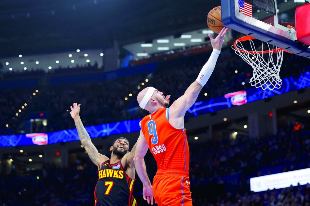 Oklahoma City Thunder's Alex Caruso (9) goes up for a basket in front of Atlanta Hawks' Nickeil Alexander-Walker (7) at Paycom Center. — Imagn Images