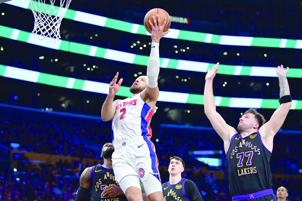 Detroit Pistons' Cade Cunningham (2) shoots ahead of Los Angeles Lakers' Luka Doncic (77)  at Crypto.com Arena. — Imagn Images