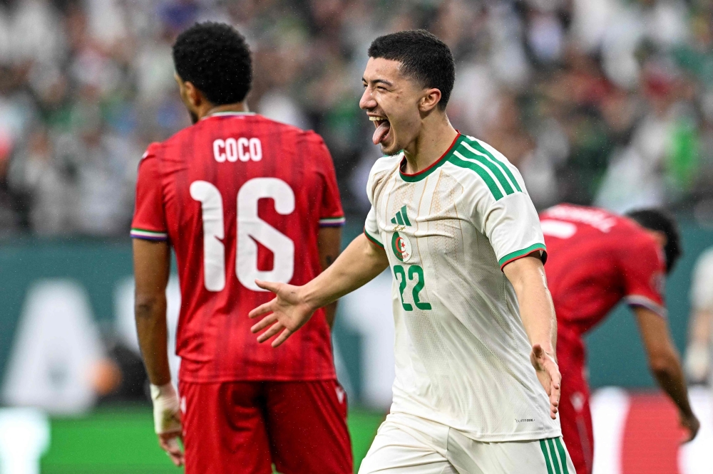 Algeria's midfielder #22 Ibrahim Maza celebrates scoring his team's third goal 