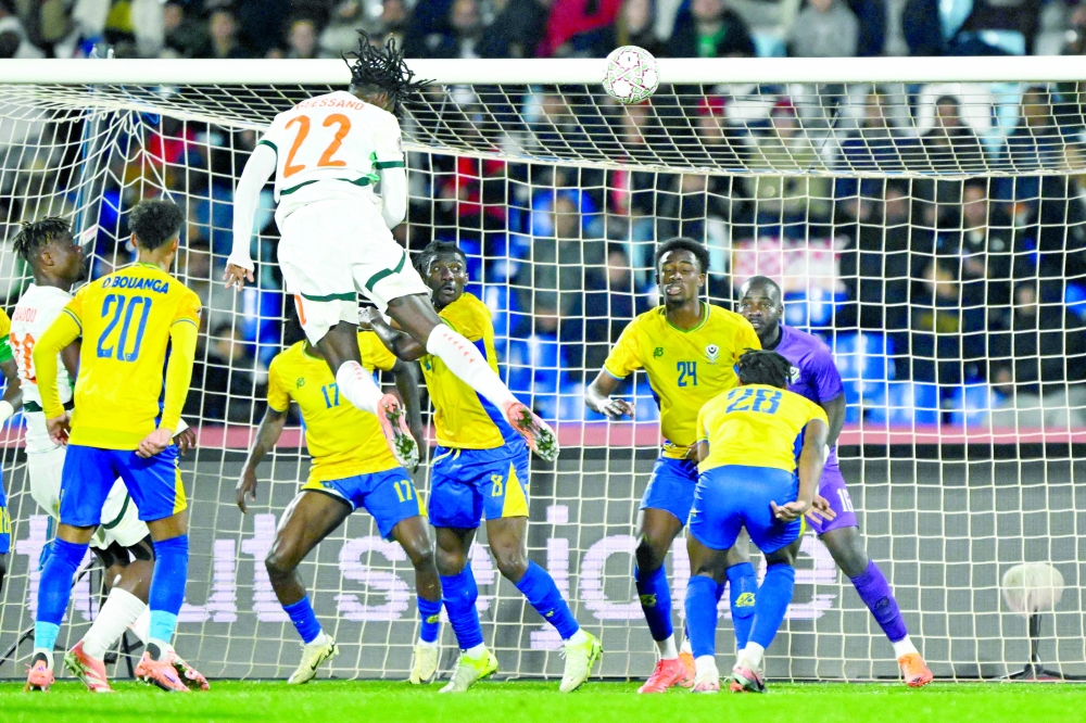 Ivory Coast's forward #22 Evann Guessand scores his team's second goal during the Africa Cup of Nations (CAN) Group F football match between Gabon and Ivory Coast at the Grand Stadium in Marrakech on December 31, 2025.   (Photo by Khaled DESOUKI / AFP)
