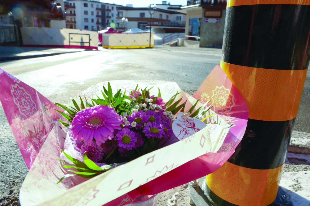 
Flower tributes are left near the ‘Le Constellation’ bar after an explosion and fire during a New Year’s Eve party where several people died and others were injured in the upscale ski resort of Crans-Montana in southwestern Switzerland. — Reuters 