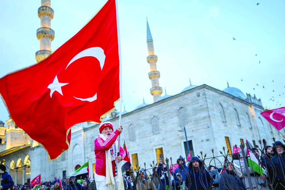
People demonstrate in solidarity with the Palestinian people amid the ongoing war between Israel and the Hamas in the Gaza enclave, at the Galata Bridge in Istanbul. — AFP 