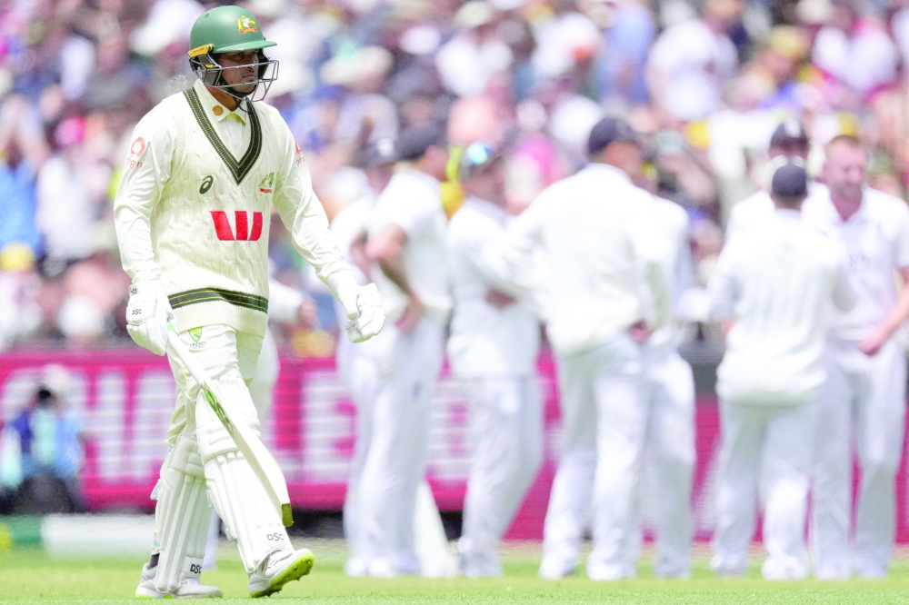 Usman Khawaja of Australia departs after being dismissed by England's Gus Atkinson during the fourth Ashes Test against England at MCG, Melbourne. — Reuters