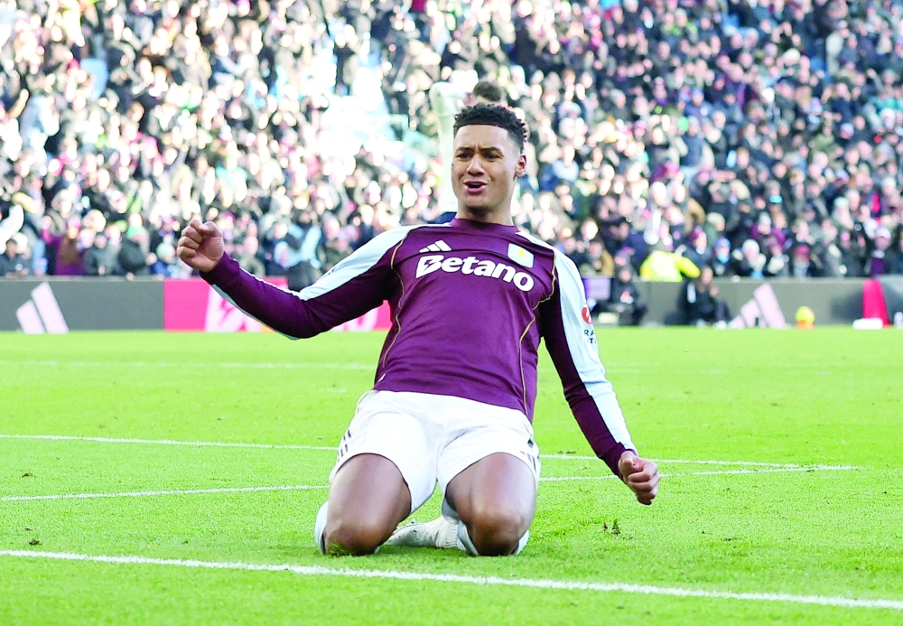 Ollie Watkins celebrates scoring their first goal. — Reuters