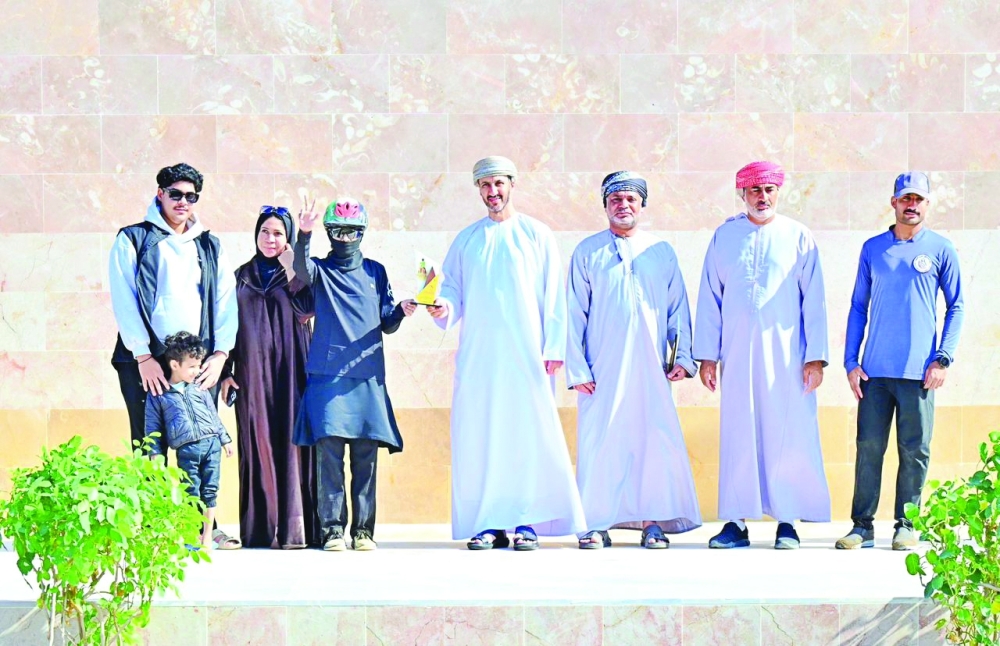 Crowning the winner in first place. — Rashid al Touqi