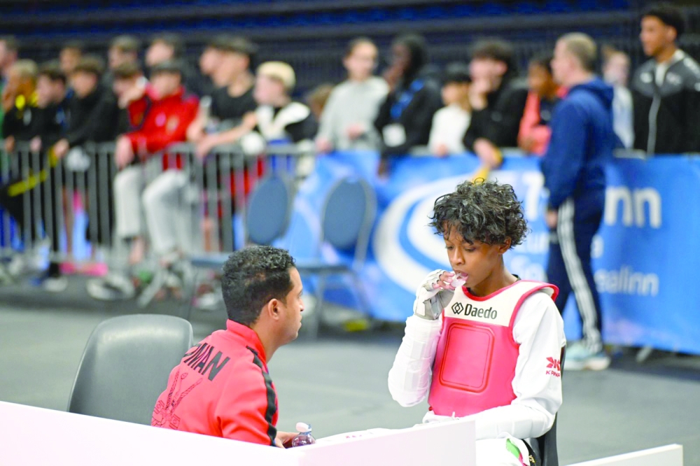 Al Muhannad al Balushi receiving instructions from the coach before starting the competition.