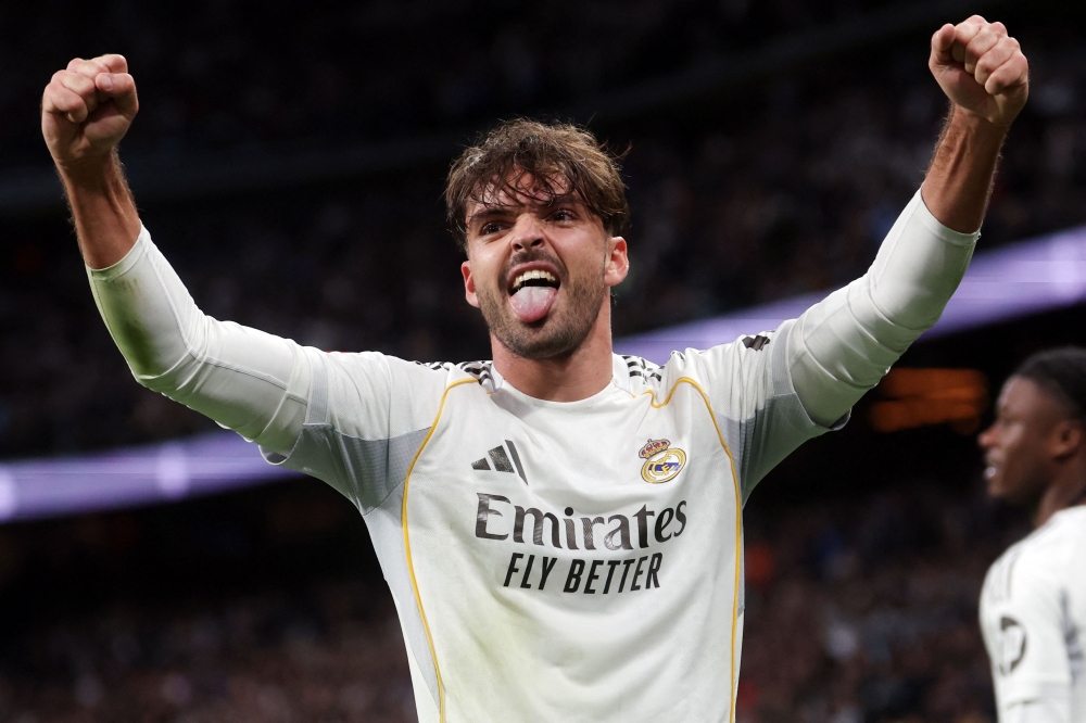 Real Madrid's Raul Asencio celebrates scoring his team's third goal 