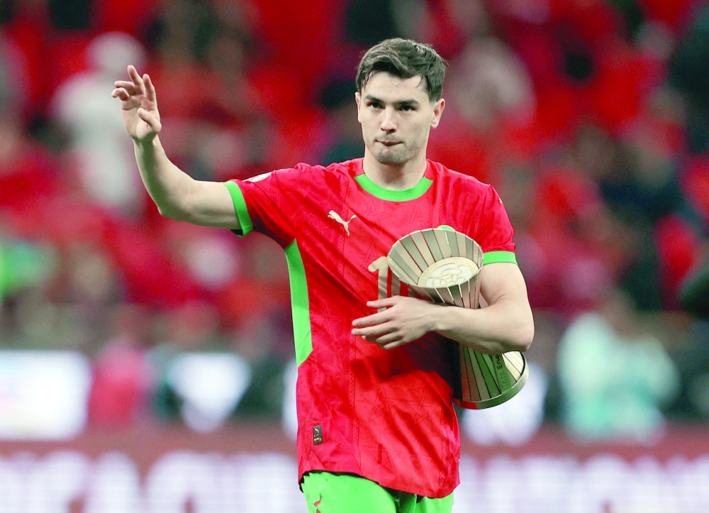 Soccer Football - CAF Africa Cup of Nations - Morocco 2025 - Round of 16 - Morocco v Tanzania - Prince Moulay Abdellah Stadium, Rabat, Morocco - January 4, 2026 Morocco's Brahim Diaz celebrates with the man of the match trophy after the match REUTERS/Amr Abdallah Dalsh