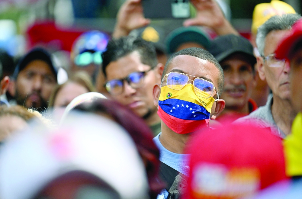 Supporters of ousted Venezuela's President Nicolas Maduro attend a rally outside the National Assembly in Caracas on Monday. — AFP