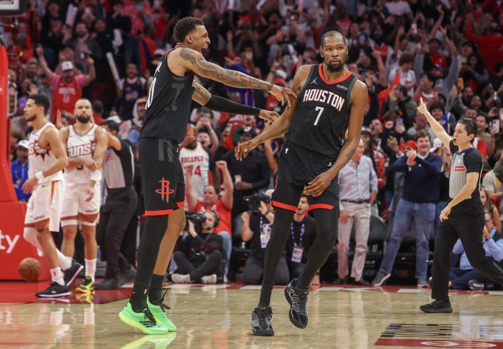 Houston Rockets forward Jabari (10) celebrates forward Kevin (7) in the fourth quarter at Toyota Center