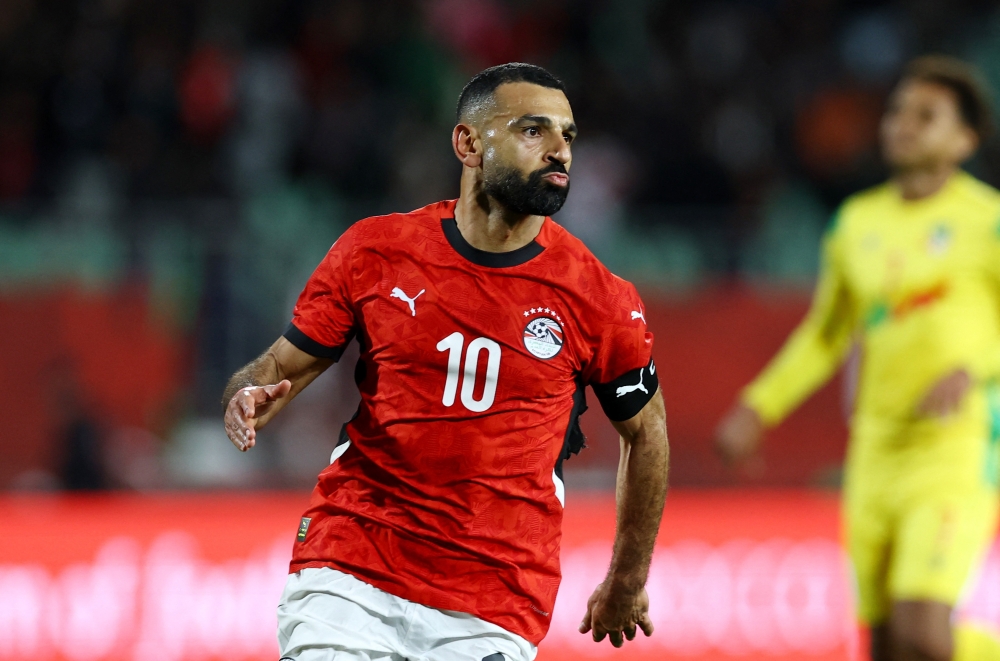 Egypt's Mohamed Salah celebrates scoring their third goal 