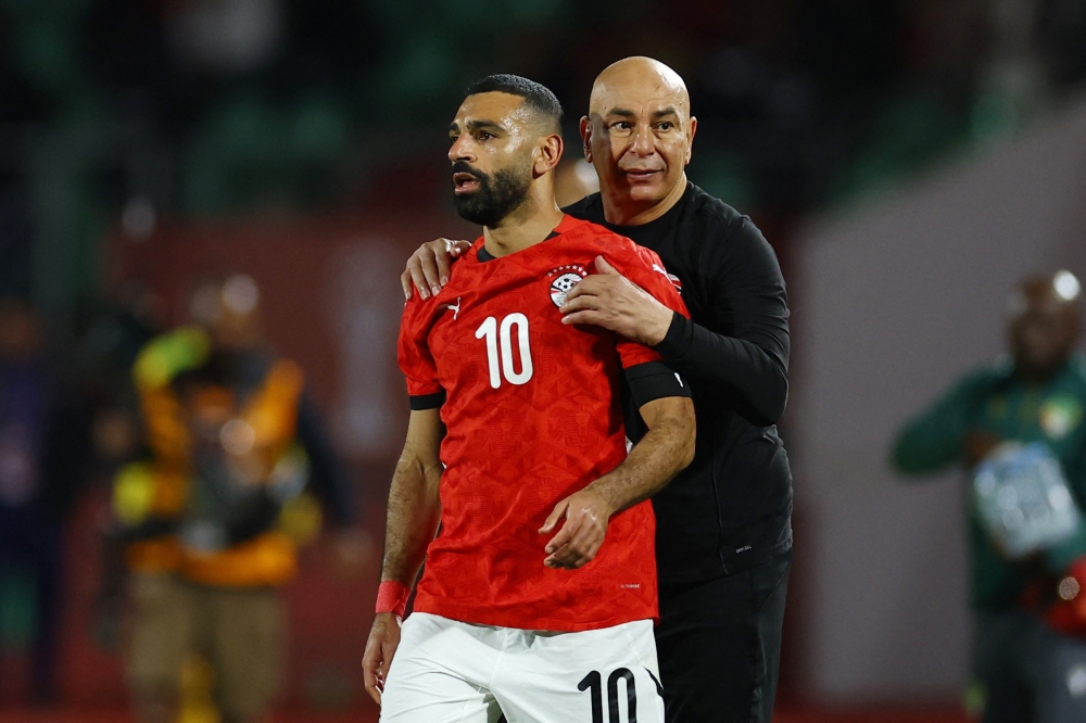Egypt's Mohamed Salah and coach Hossam Hassan