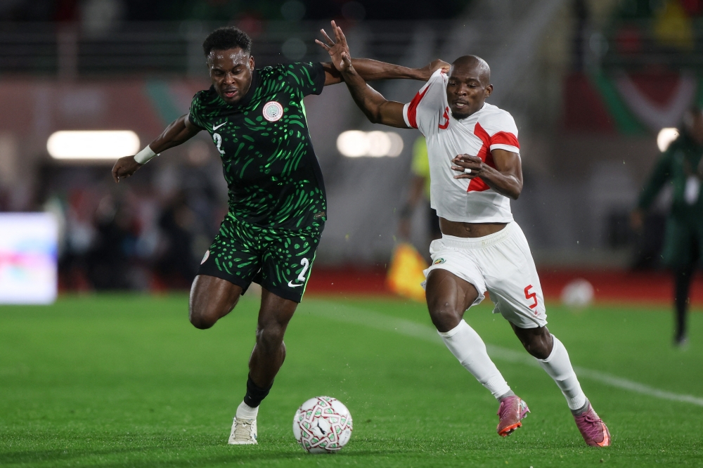  Nigeria's Bright Osayi-Samuel in action with Mozambique's Bruno Langa 
