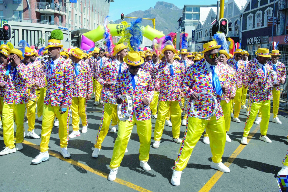 Members of a troupe take part in the annual parade of Tweede Nuwe Jaar (Second New Year) in Cape Town on January 5, 2026.  (Photo by RODGER BOSCH / AFP)
