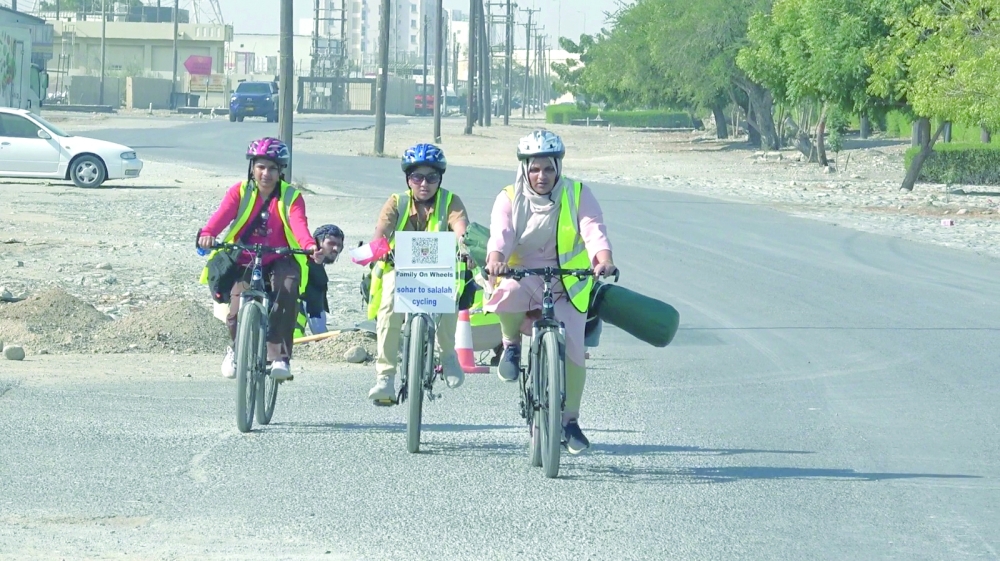 Ramsheena, cycling with Mohammed Hannan and Amina
